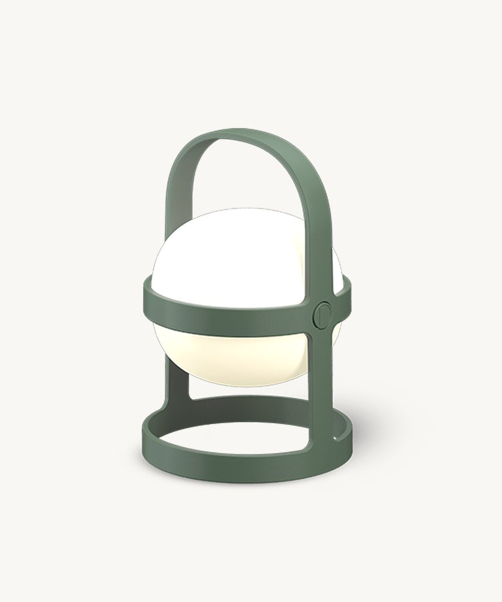 The Rosendahl Soft Spot Solar Circular in Pine Green is a modern, round portable lamp with a glowing white center, shown on a plain light background.