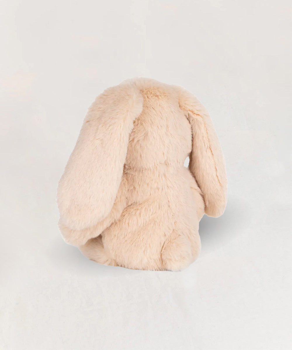 Bubbles le Bunny, a soft, light beige plush bunny toy, is shown from the back against a plain, light background.