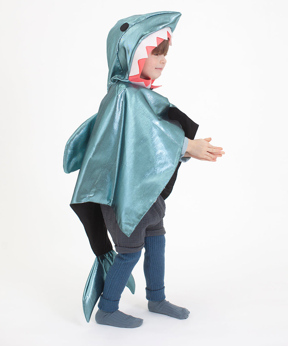 Child in a Shark Costume with fin and open jaws, standing sideways against a white background.