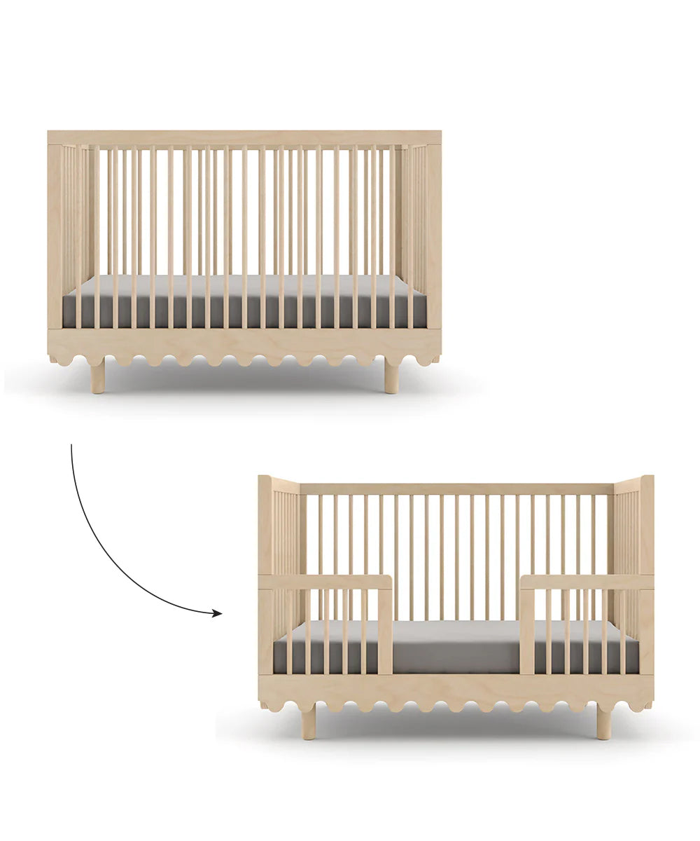 The Moss Crib Conversion Kit transforms a convertible crib into a toddler bed, complete with optional side guardrails.