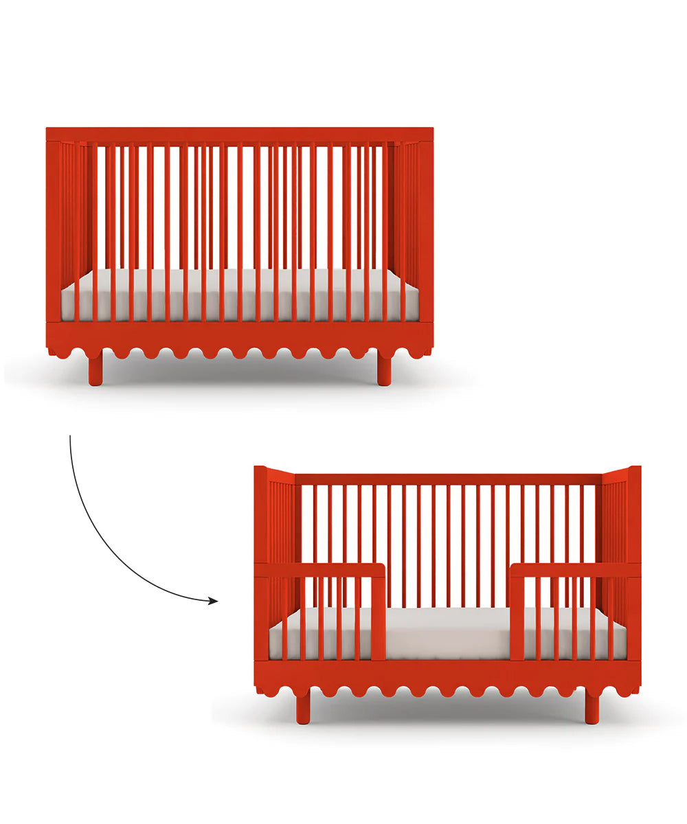 The Moss Crib Conversion Kit features a red crib with removable slats, allowing it to transform into a toddler bed.