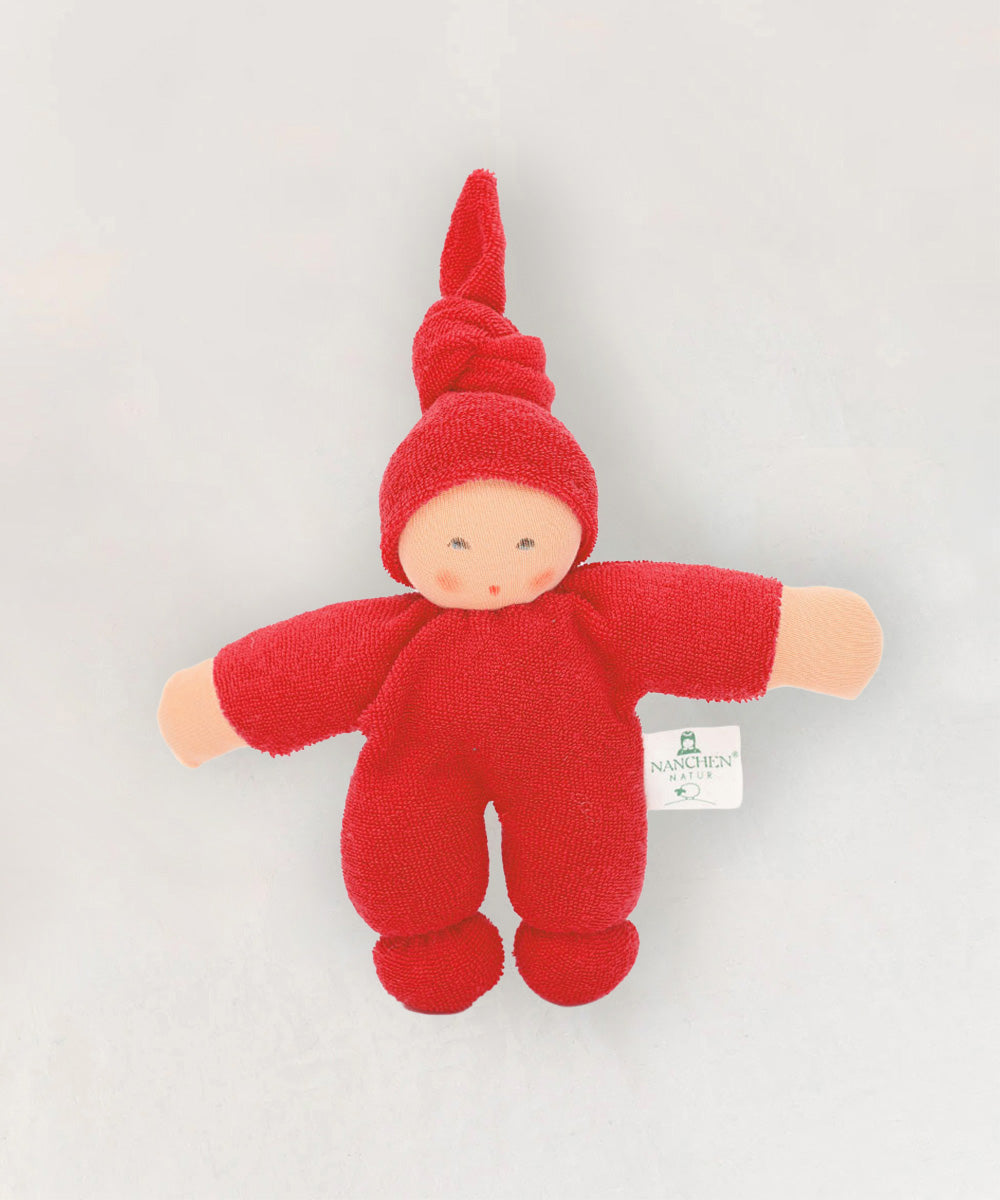 Waldorf Doll - Red: Soft doll with round hands and feet, red outfit, and pointed hat, shown lying on a light background.