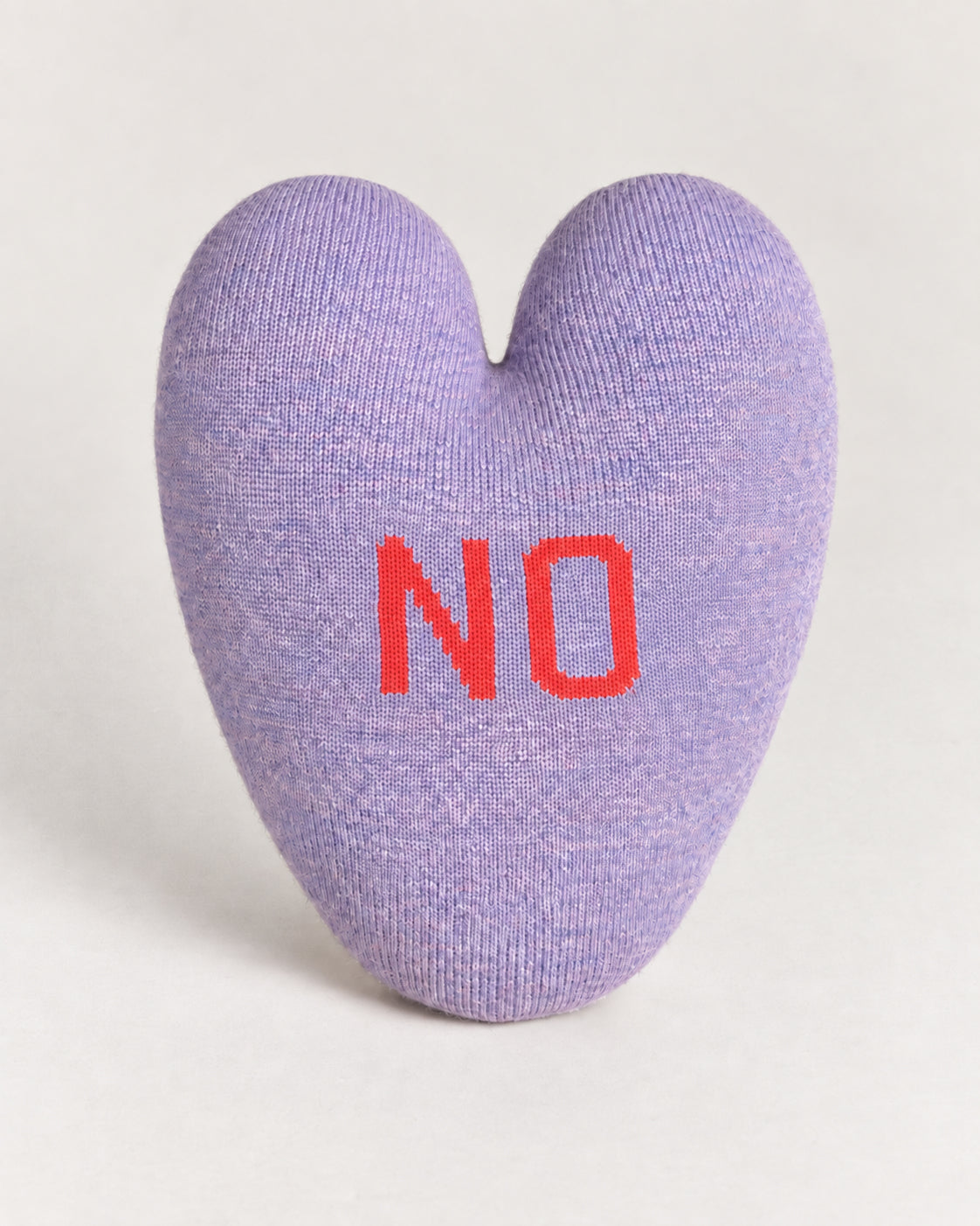 Lavender Yes/No Heart Pillow shaped like a heart with the word “NO” stitched in red on the front.