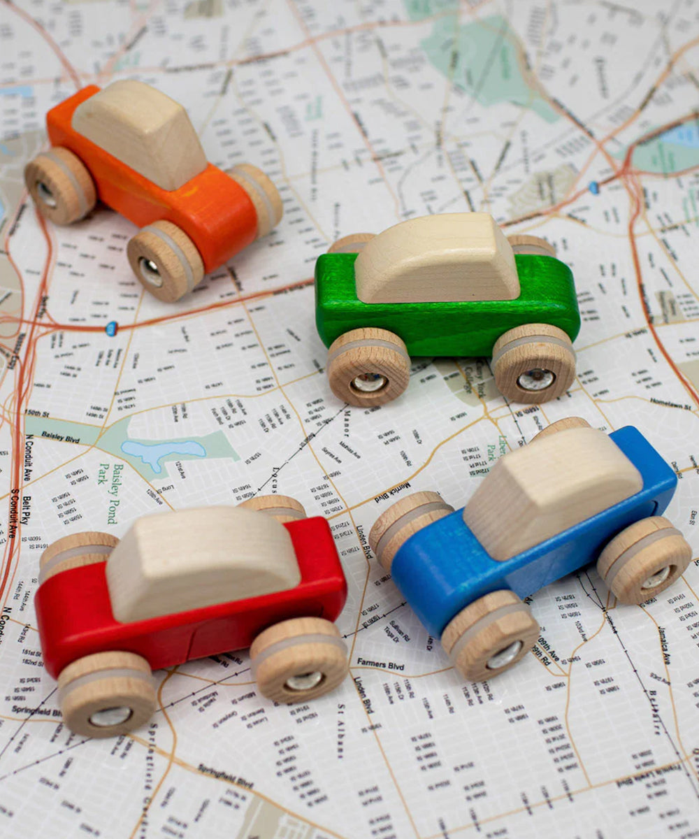 A Le Pull-Back Car - Blue sits on a street map background.
