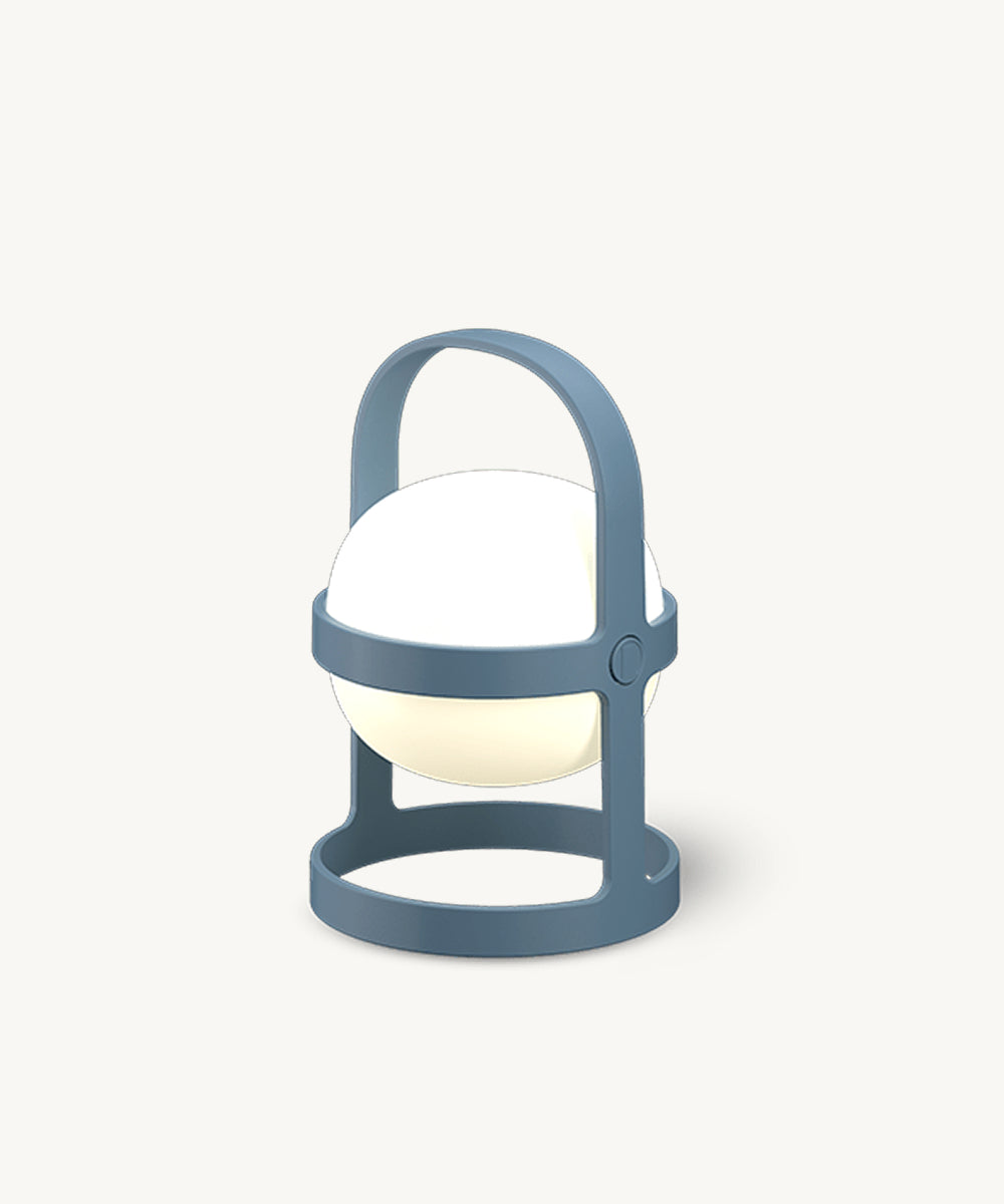 The Rosendahl Soft Spot Solar Circular in Sky Blue: a modern portable lamp with handle and round base, shown on a plain white background.