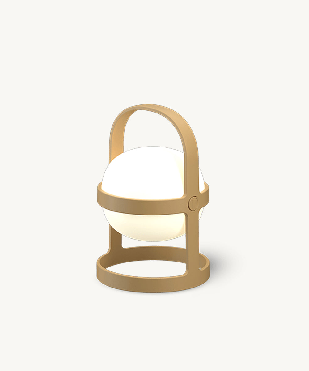The Rosendahl Soft Spot Solar Circular in Wheat is a round, white lamp with a tan handle and base, glowing softly against a plain background.