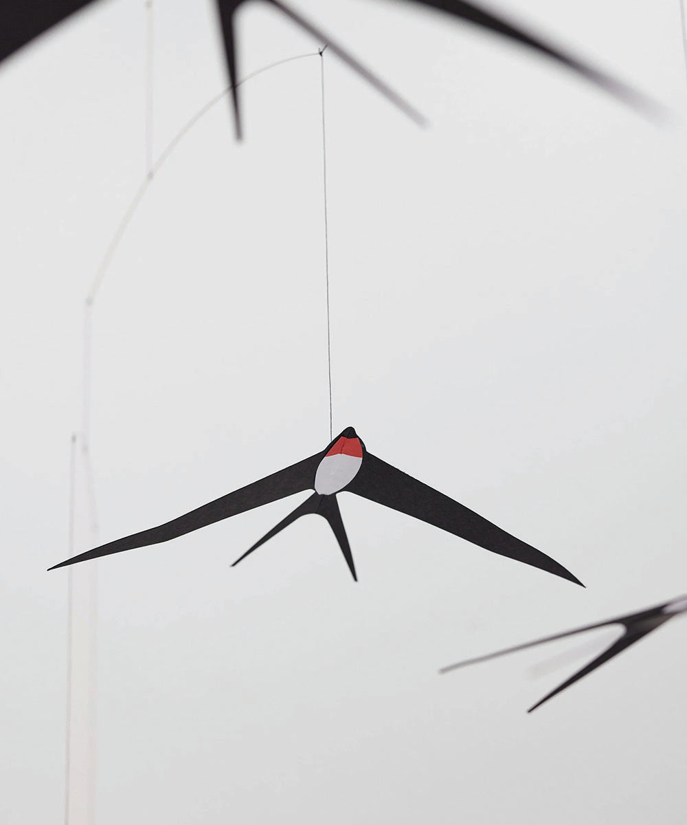 Le Mobile - Flying Swallows 5 hanging from the ceiling against a plain white background.