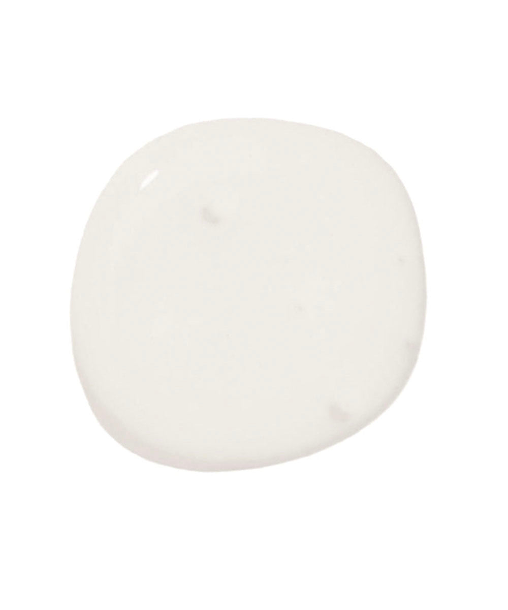 A drop of Touch-up Paint, round and white, on a plain white background.