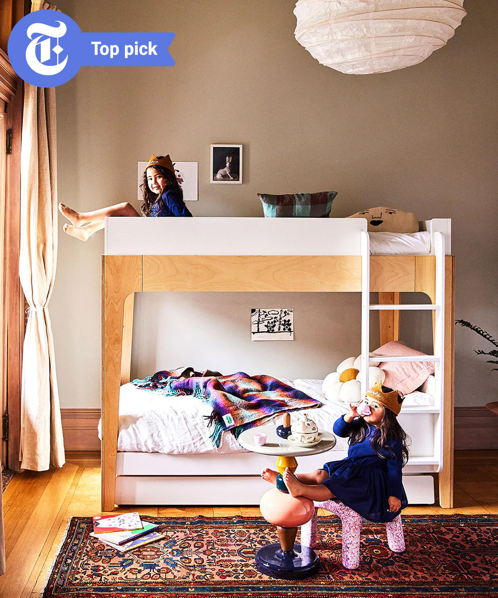 Two kids with crowns play in a stylish room featuring the Perch Twin Bunk Bed and colorful decor. “Top pick” badge appears in the top left corner.