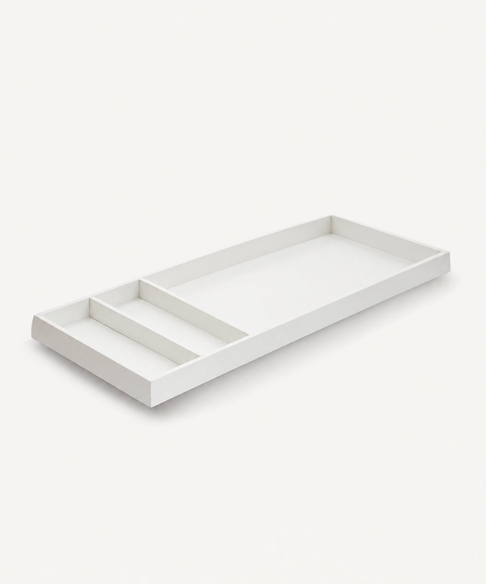 The Convertible XL Changing Station (pad not included) is a rectangular white tray with three differently sized compartments, shown on a white background.